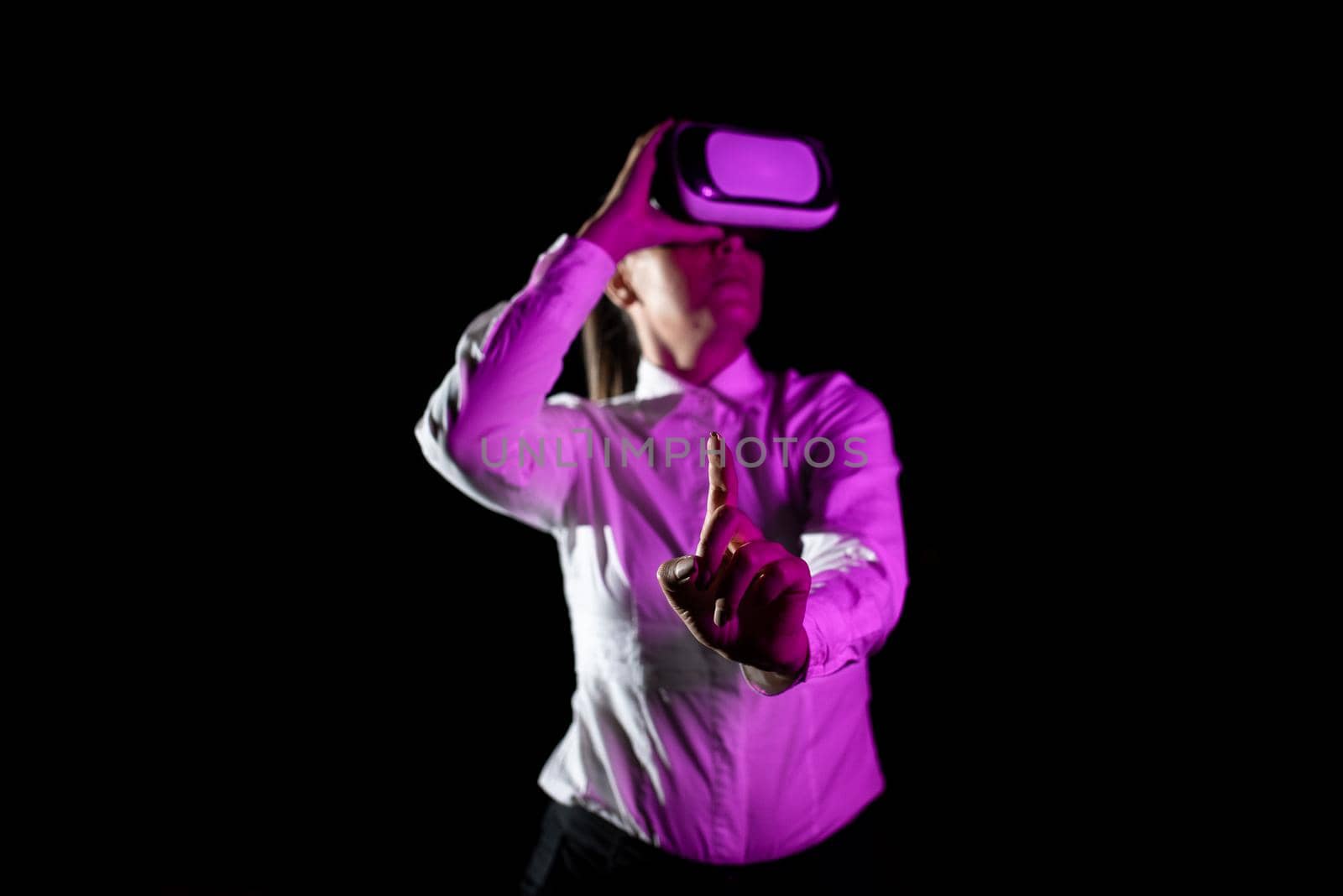 Woman Using Virtual Reality Simulator And Gesturing During Training.