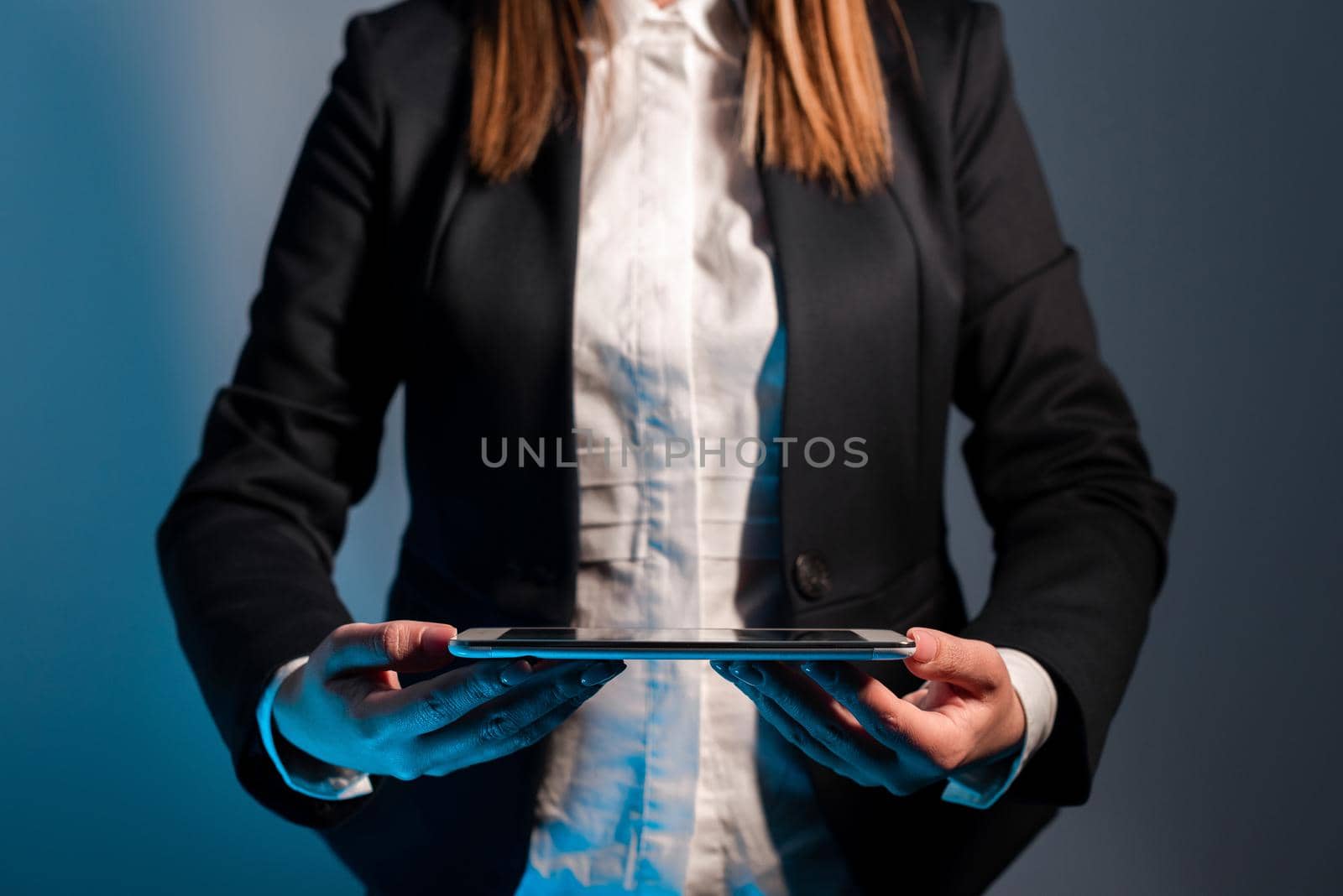 Businesswoman Holding Tablet With Important Informations On It.