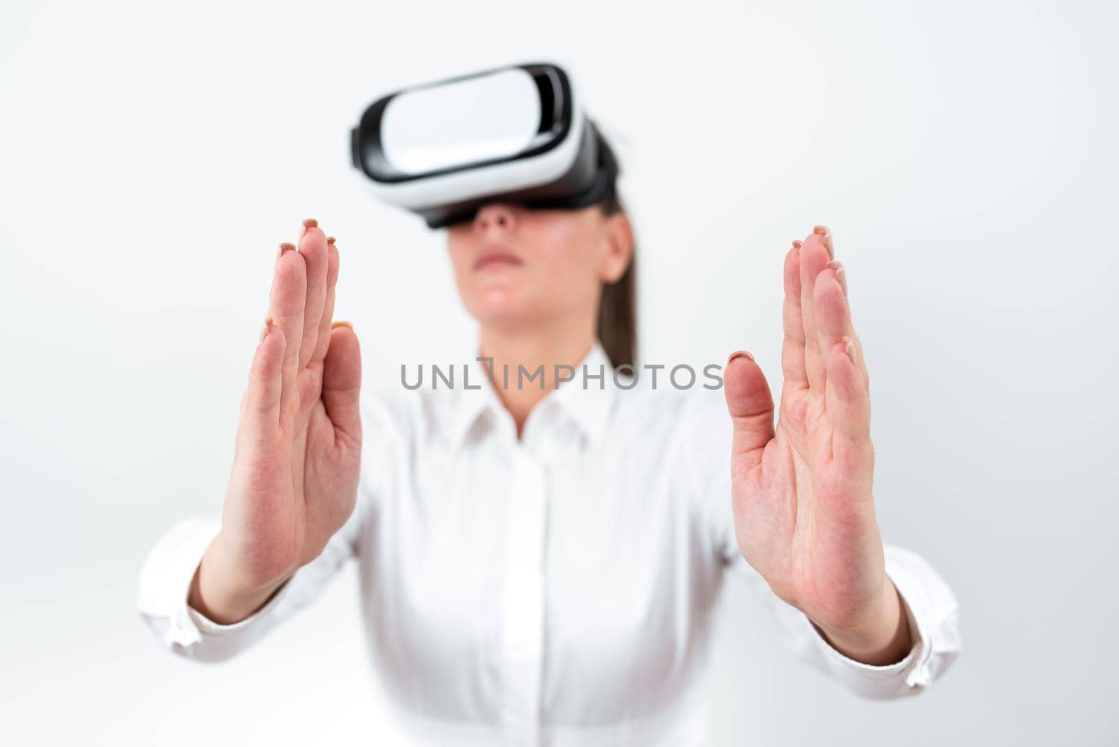 Woman Wearing Vr Glasses And Presenting Important Messages Between Hands.