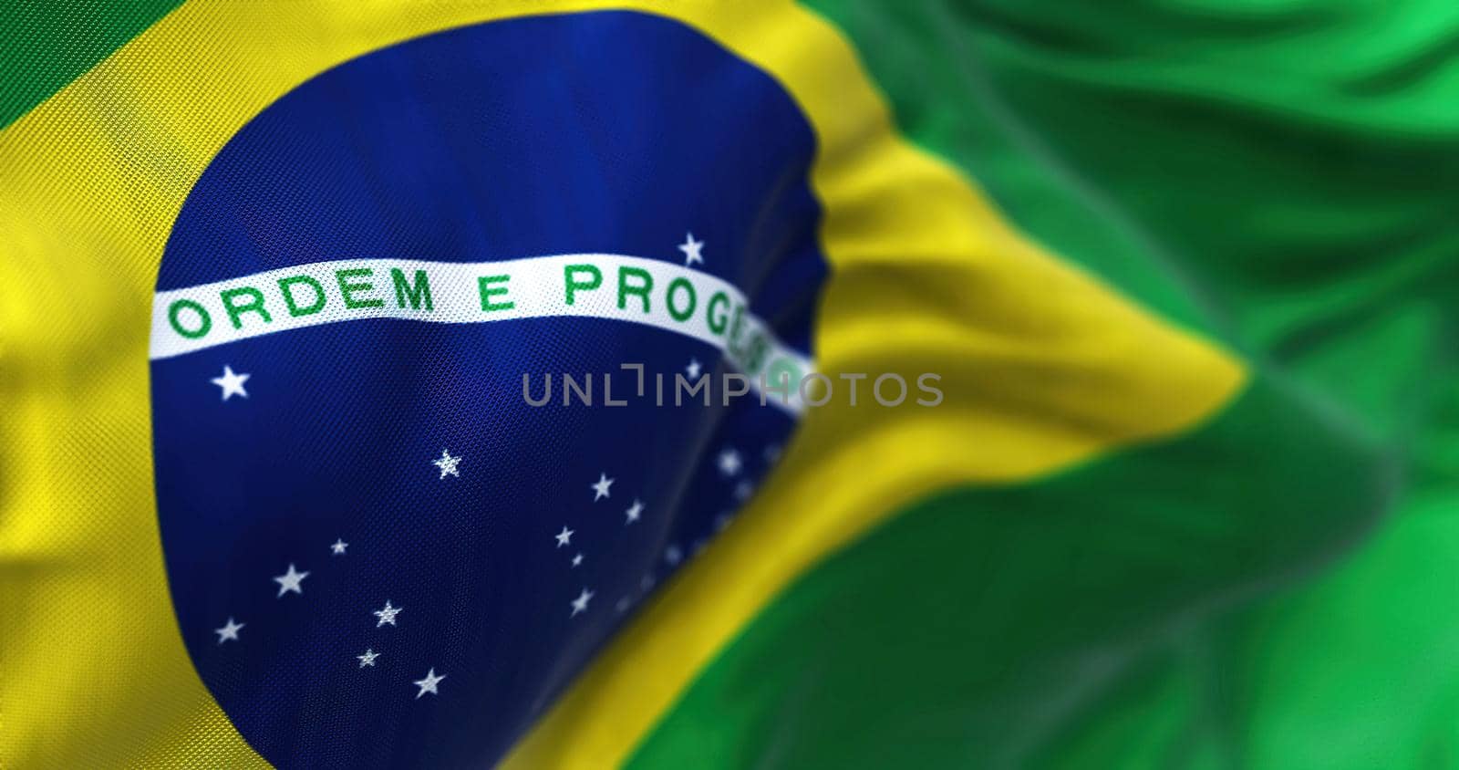 Close-up view of the Brazilian national flag waving in the wind. by rarrarorro