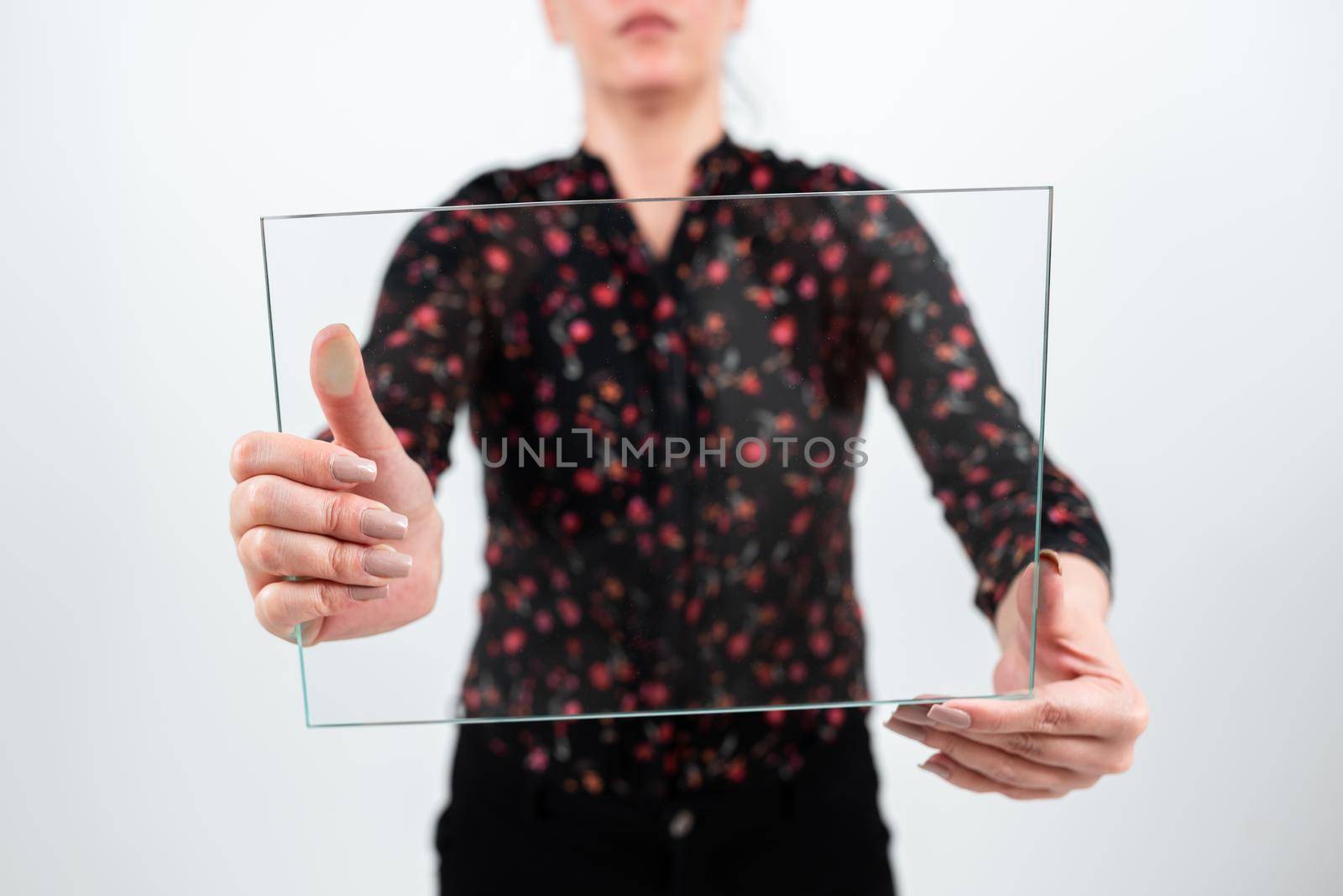 Businesswoman Holding Glass Banner For Promoting The Company.