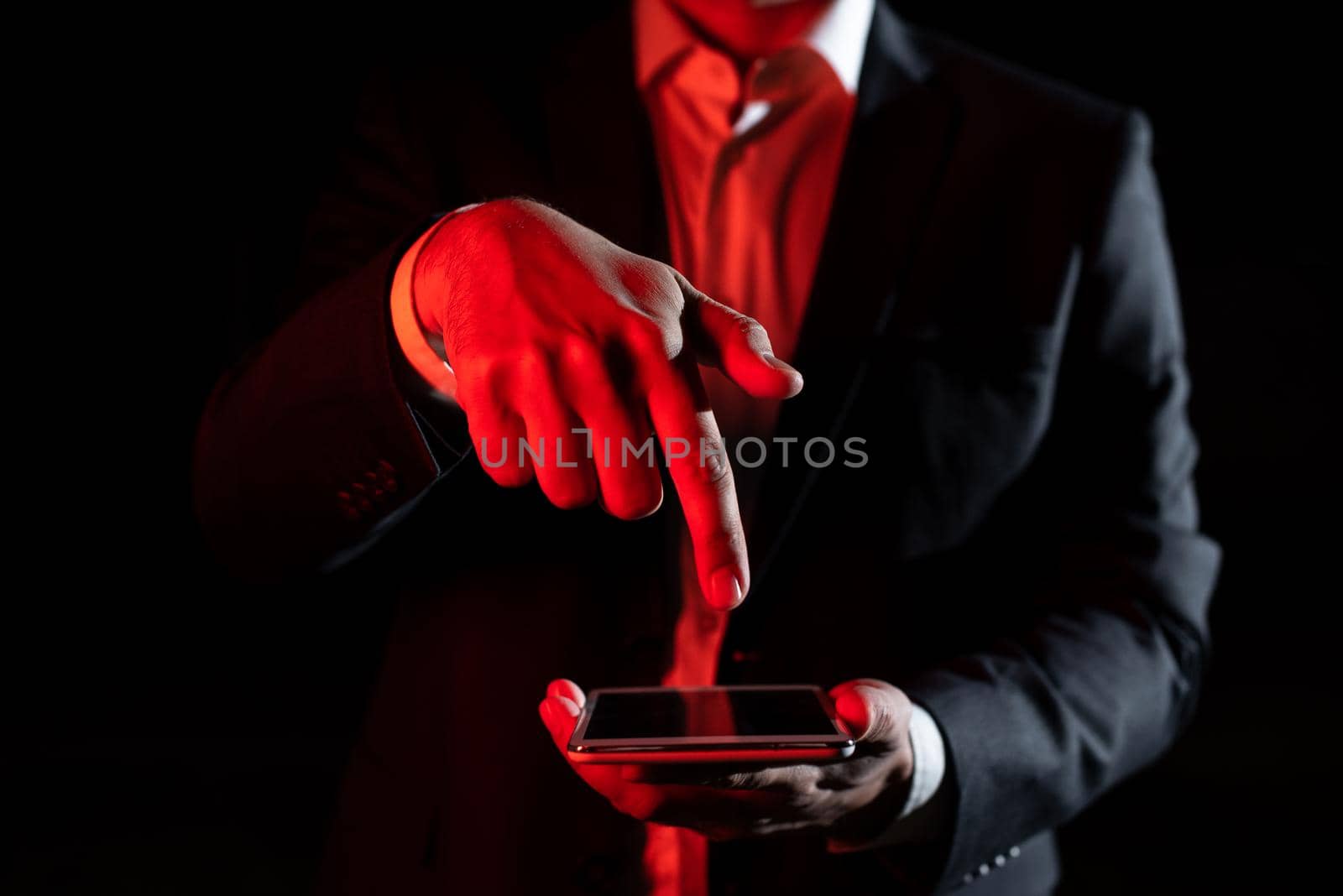 Businessman Holding Tablet And Pointing With One Finger On Important Message. Executive In Suit Presenting Crutial Information. Gentleman Showing Critical Announcement. by nialowwa