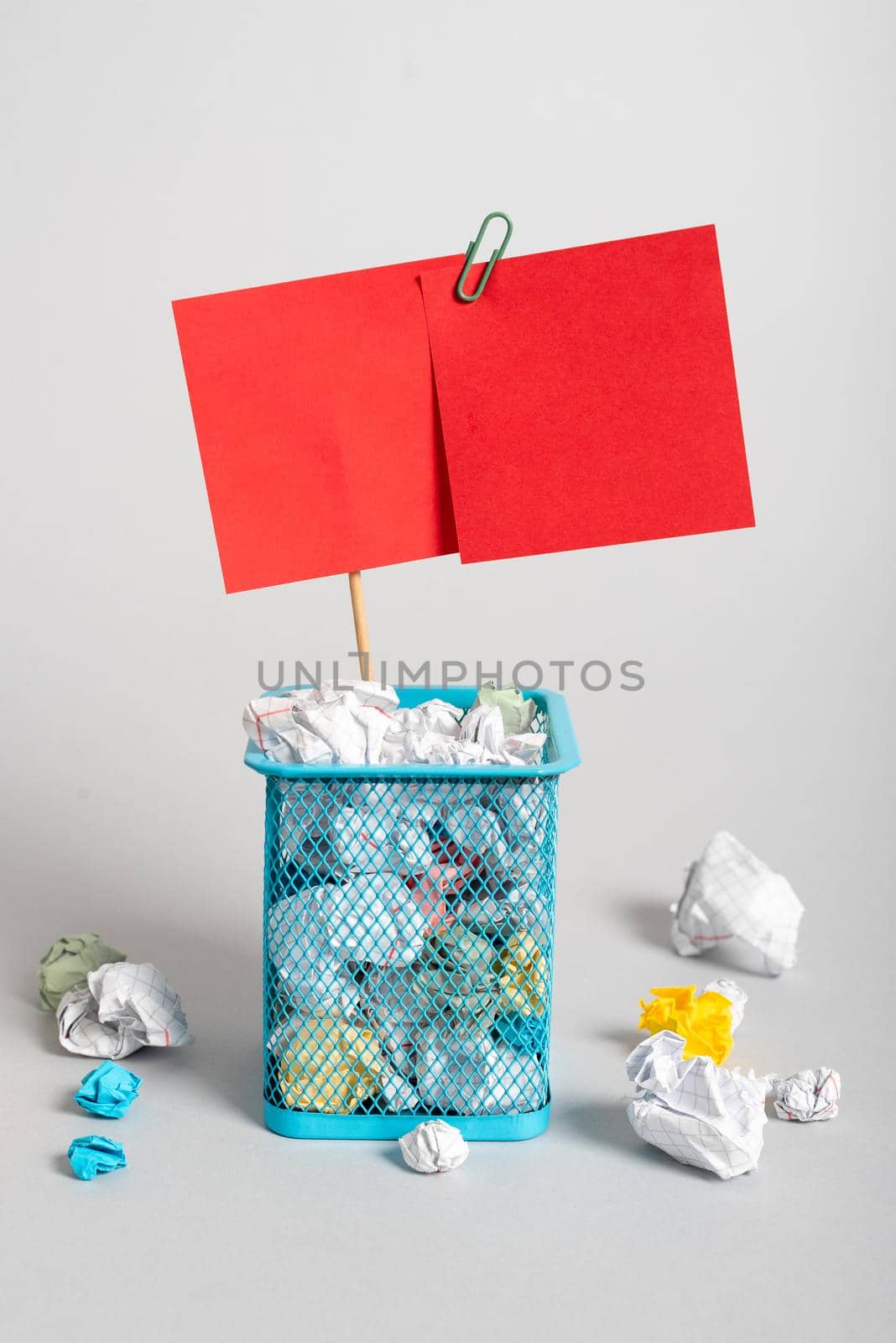 Case Full Of Paper Wraps And Two Important Messages Pinned On Stick. Bin Filled With Crumpled Notes And Different Critical Information Glued On Piece Of Wood. by nialowwa