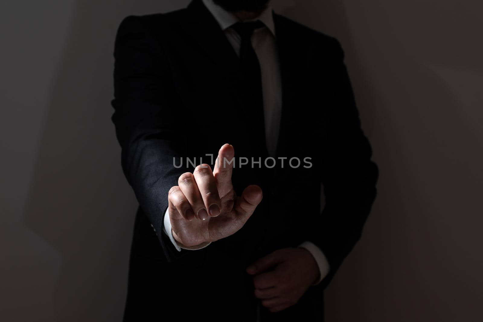 Businessman In Suit Pointing With One Finger On Important Message.