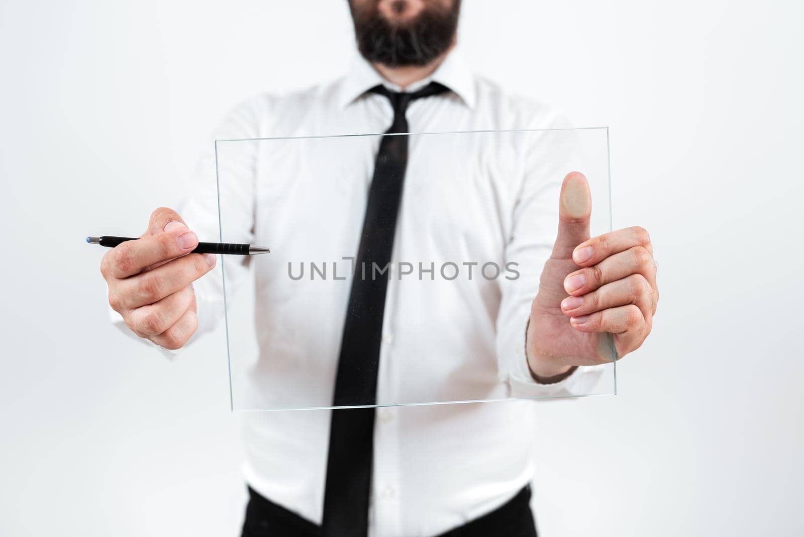 Man Pointing Pen At Glass And Showing New Ideas To Achieve Goals.