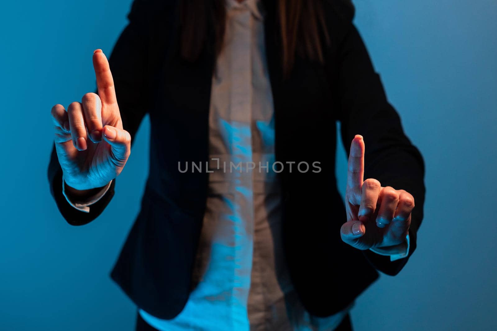 Businesswoman Pointing With Two Fingers On Important Messages. Executive In Suit Presenting Different Crutial Information. Woman Showing Critical Announcements. by nialowwa