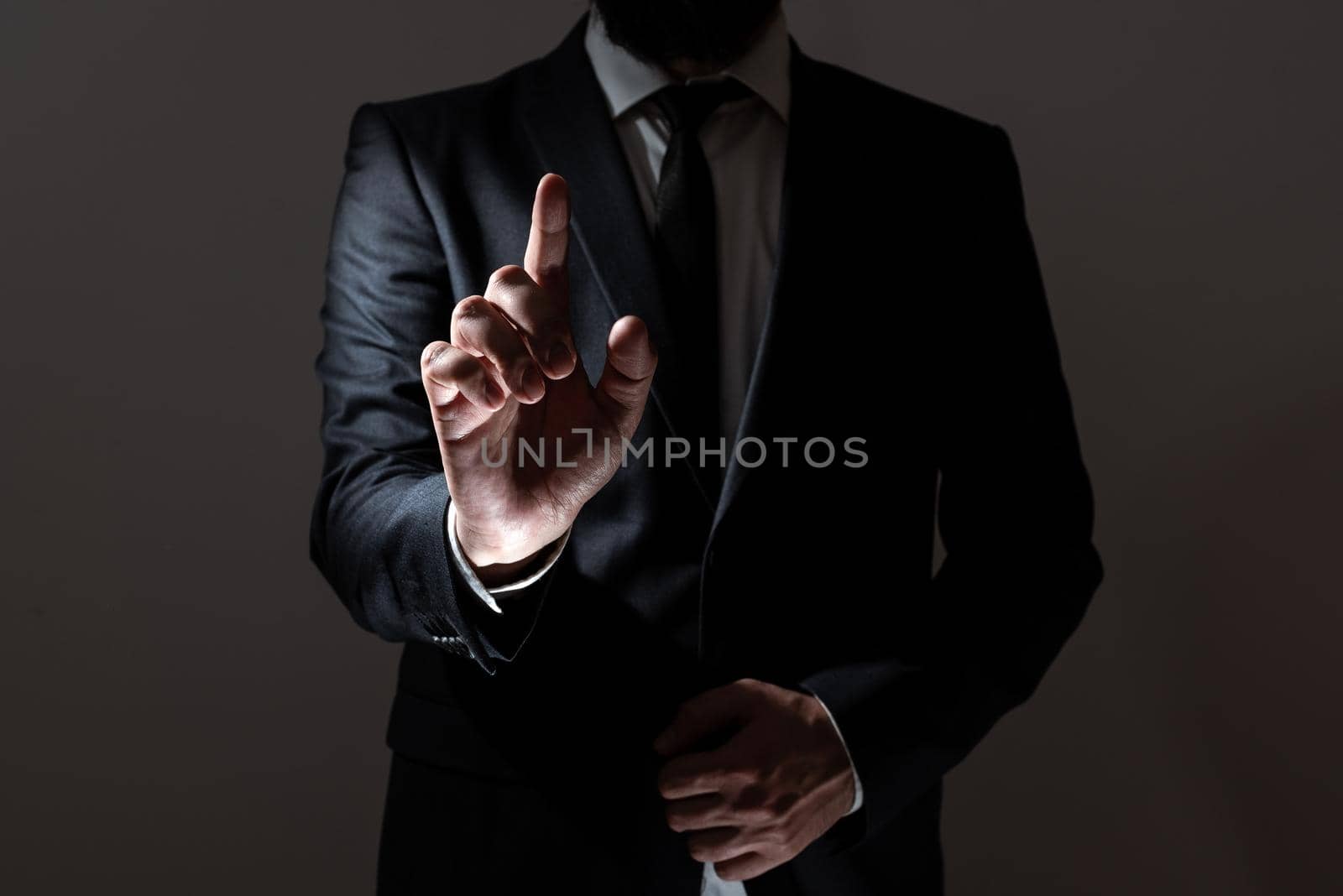 Businessman In Suit Pointing With One Finger On Important Message.