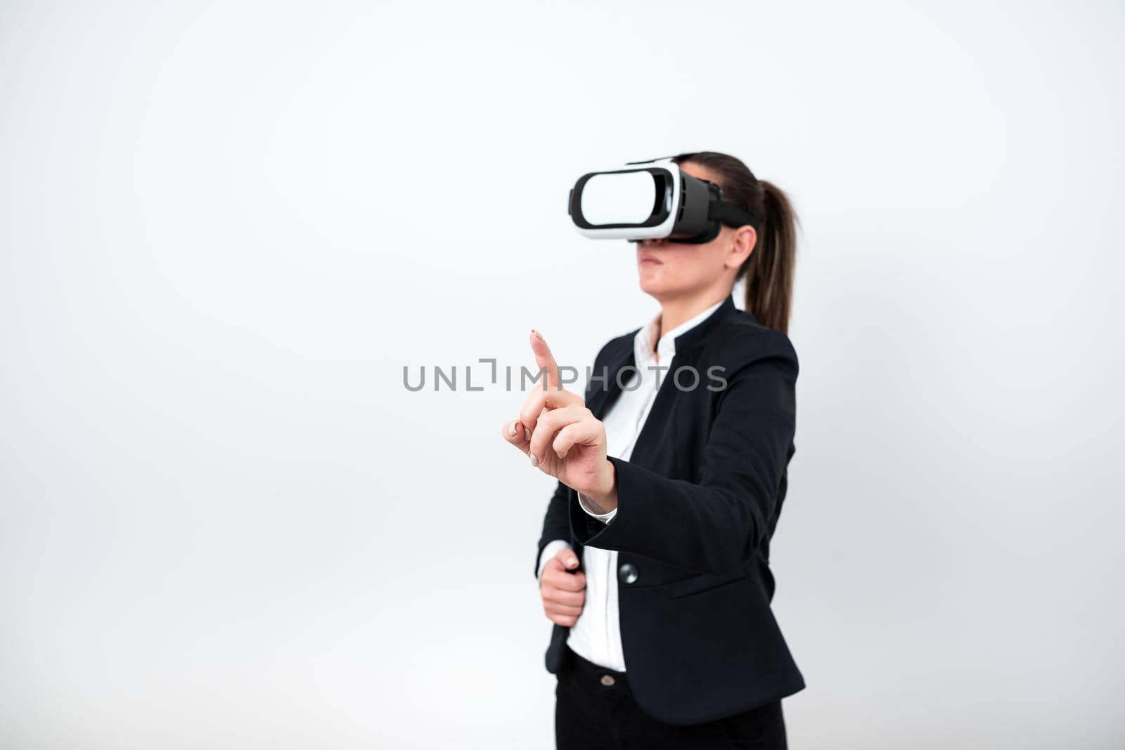 Woman Wearing Vr Glasses And Pointing On Important Message With One Finger.