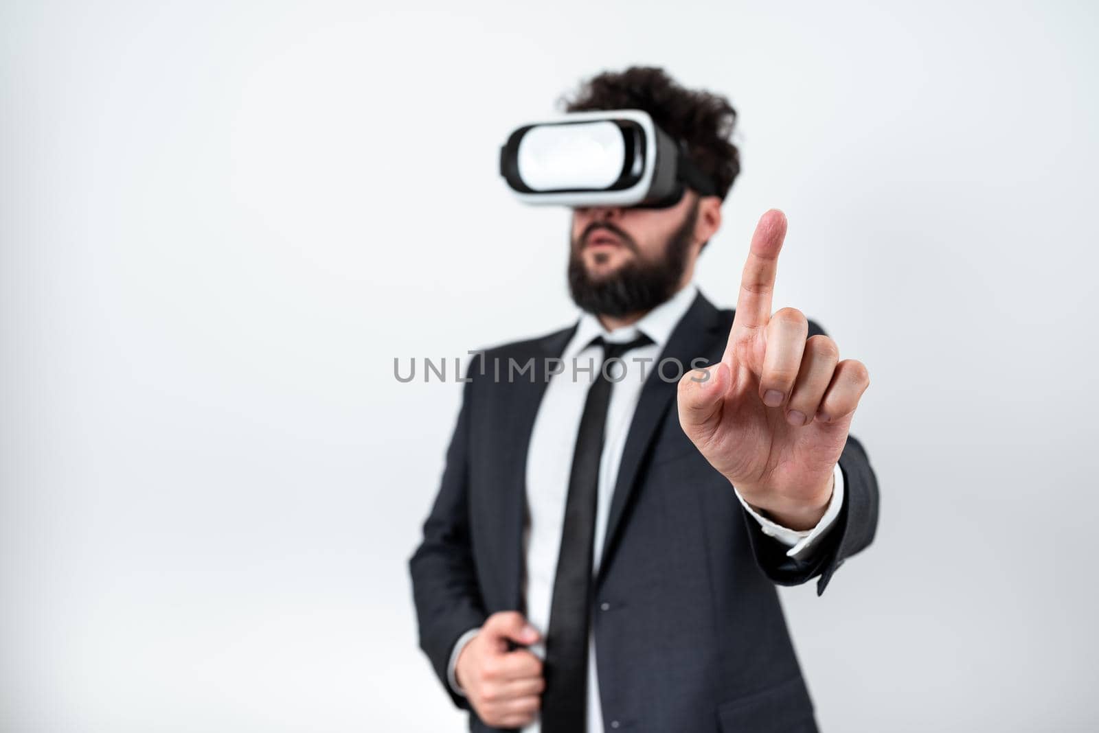 Man Wearing Vr Glasses And Pointing On Important Messages With One Finger.