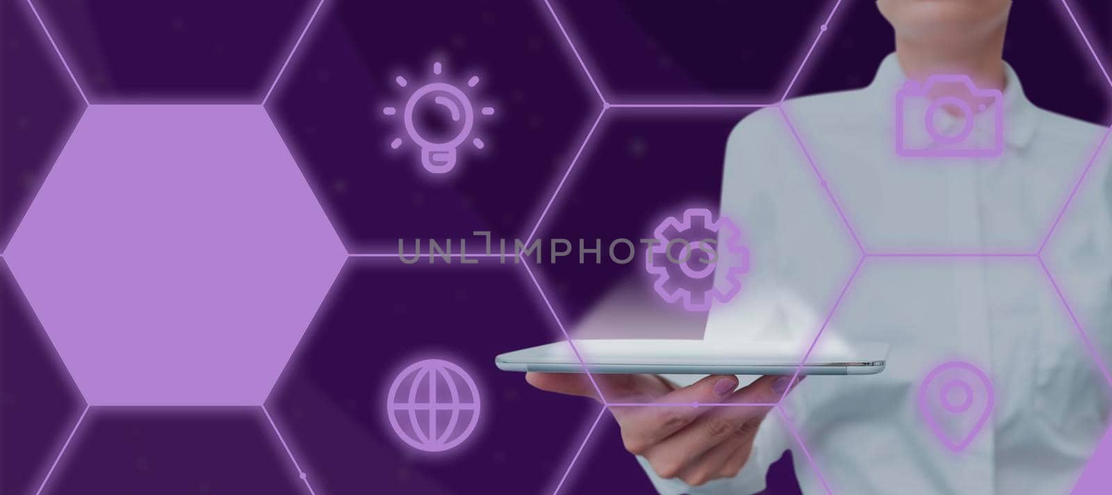 Female Professional Holding Tablet Showing Digitally Generated Multiple S In Hexagon Pattern. Elegant Woman Wearing Suit Presenting Important Business Strategies. by nialowwa