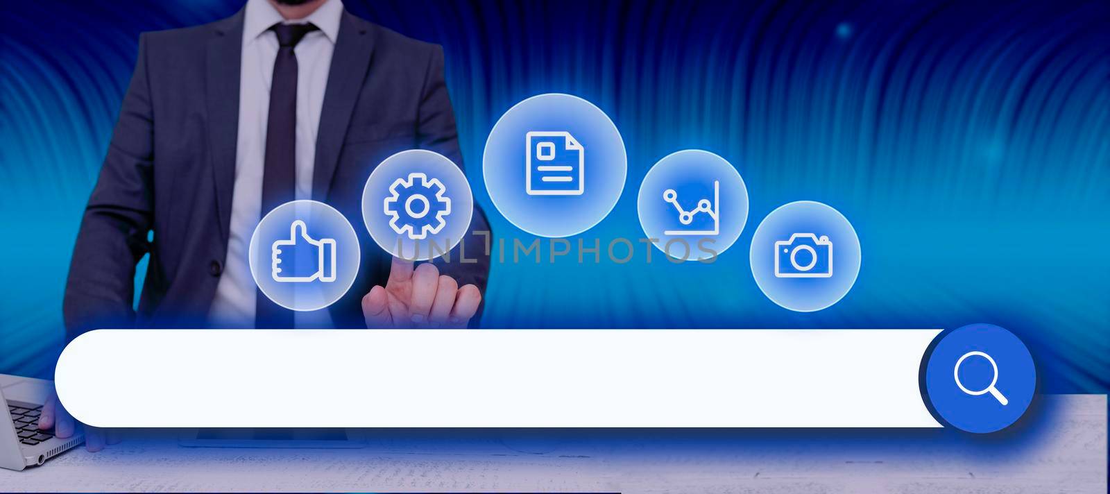 Businessman With A Laptop Pointing On Digital Synbols And Search Bar Looking For Data In An Abstract Design. Man In A Meeting And Checking Important Information And Concepts. by nialowwa