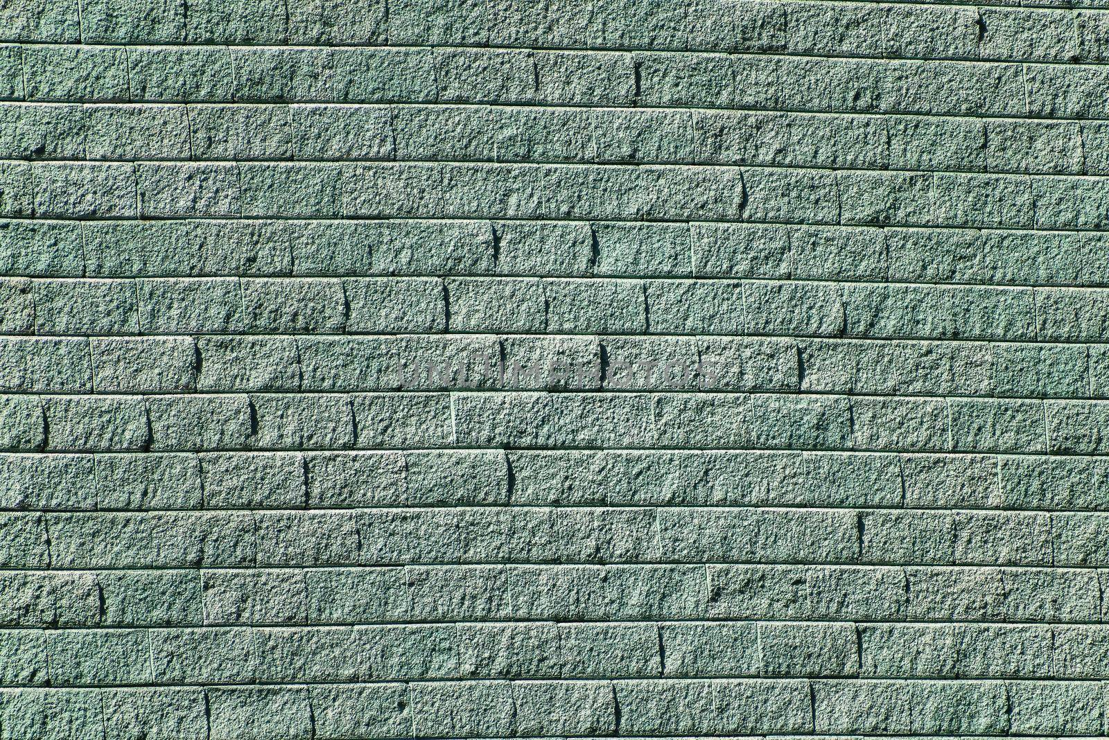 Wall of gray-green brick segments rustic by rostik924