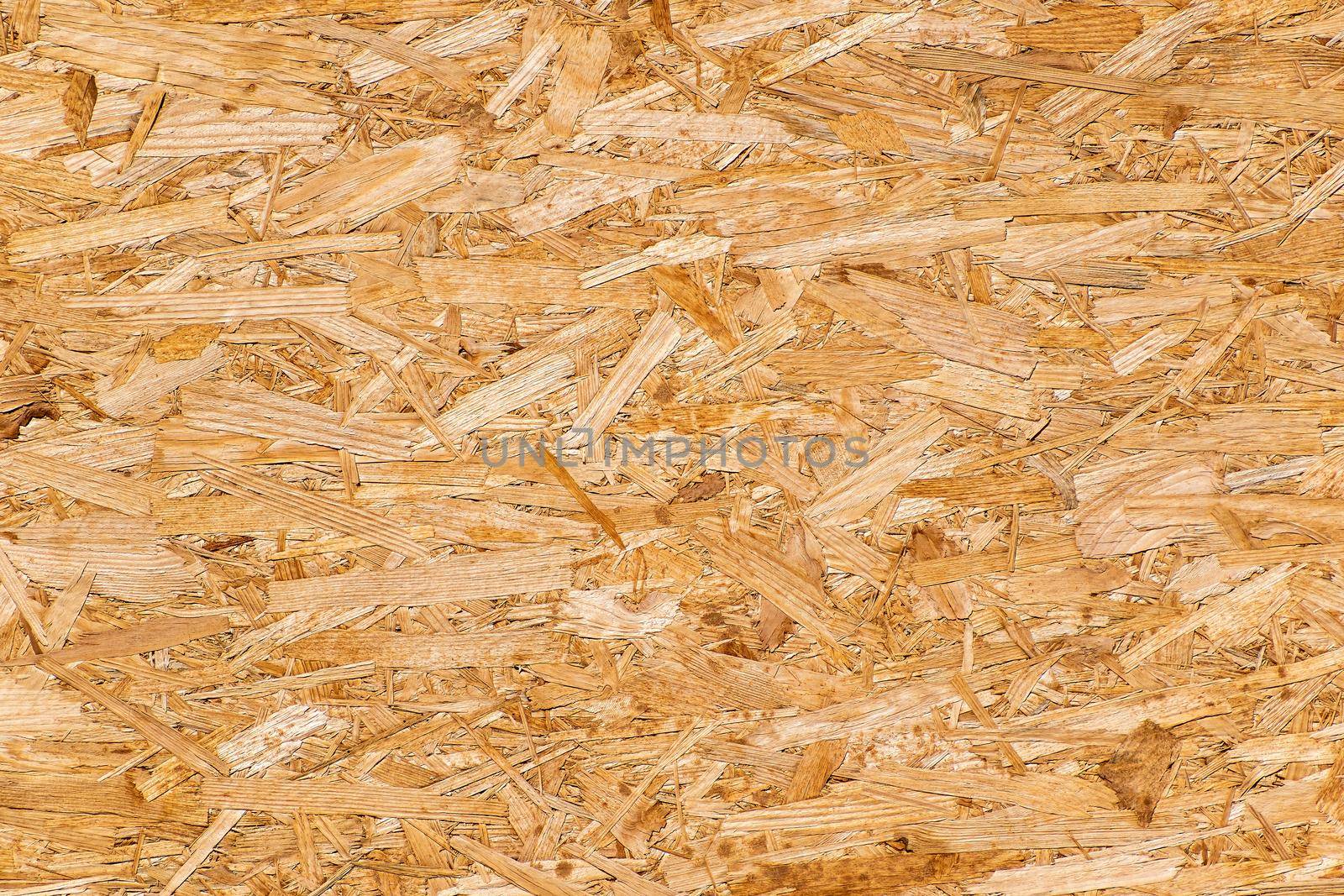 OSB plate area composed of many pressed chips Texture, background for further work.