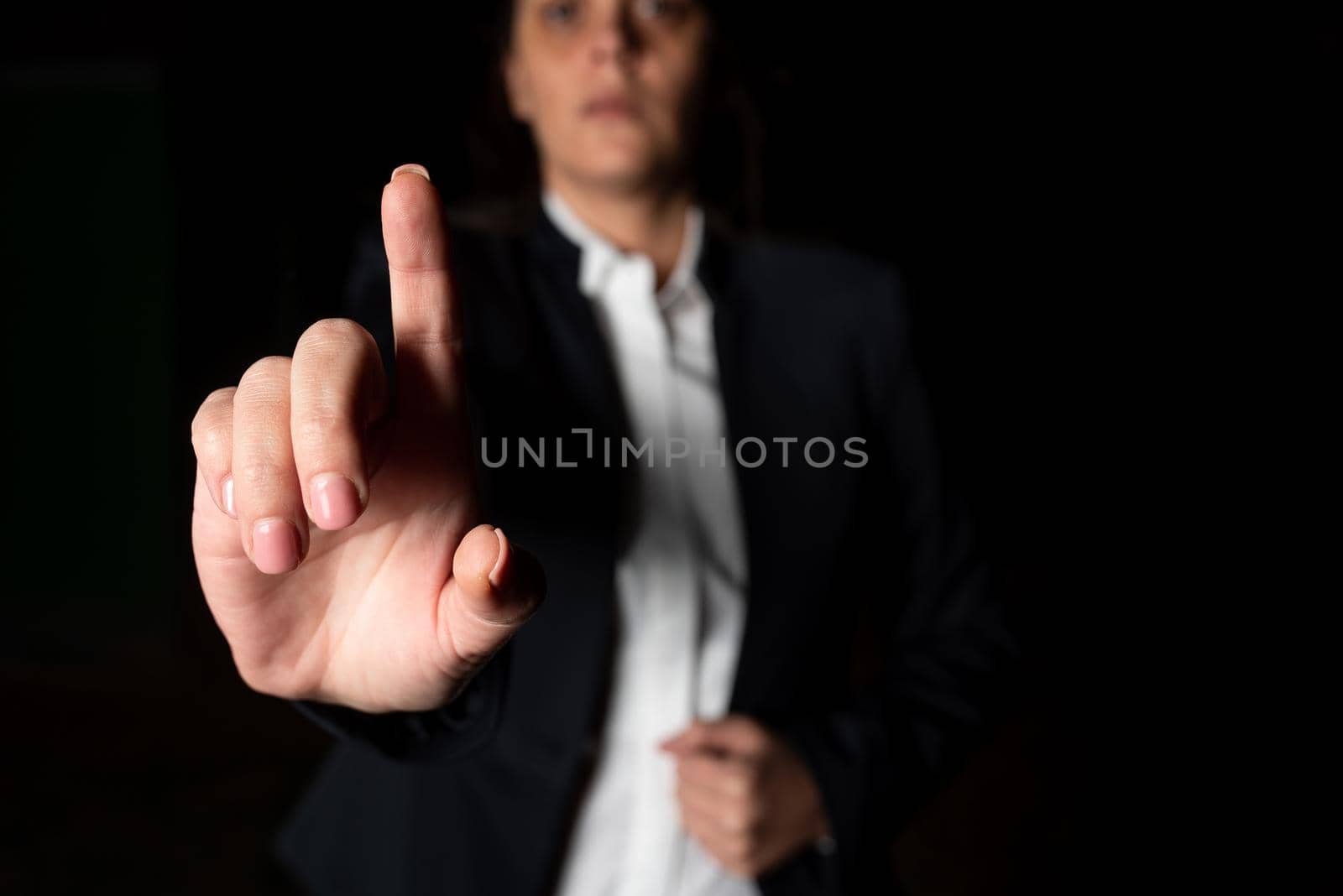 Businesswoman Pointing Important Infortmations With One Finger.