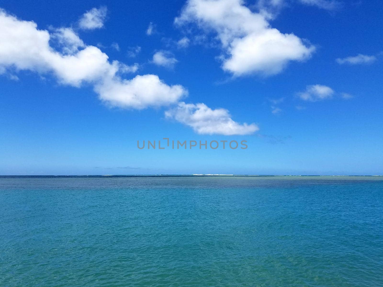 Shallow ocean waters off Maunalua Bay Beach Park  by EricGBVD