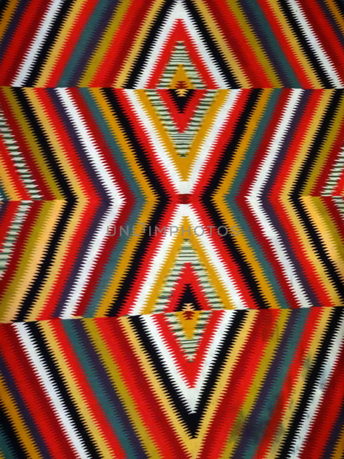 Pattern Red, Orange, White, Green, Black, and blue Diamond Blanket/ Rug - Navajo Artist, made about 1885 of cotton and wool.                              