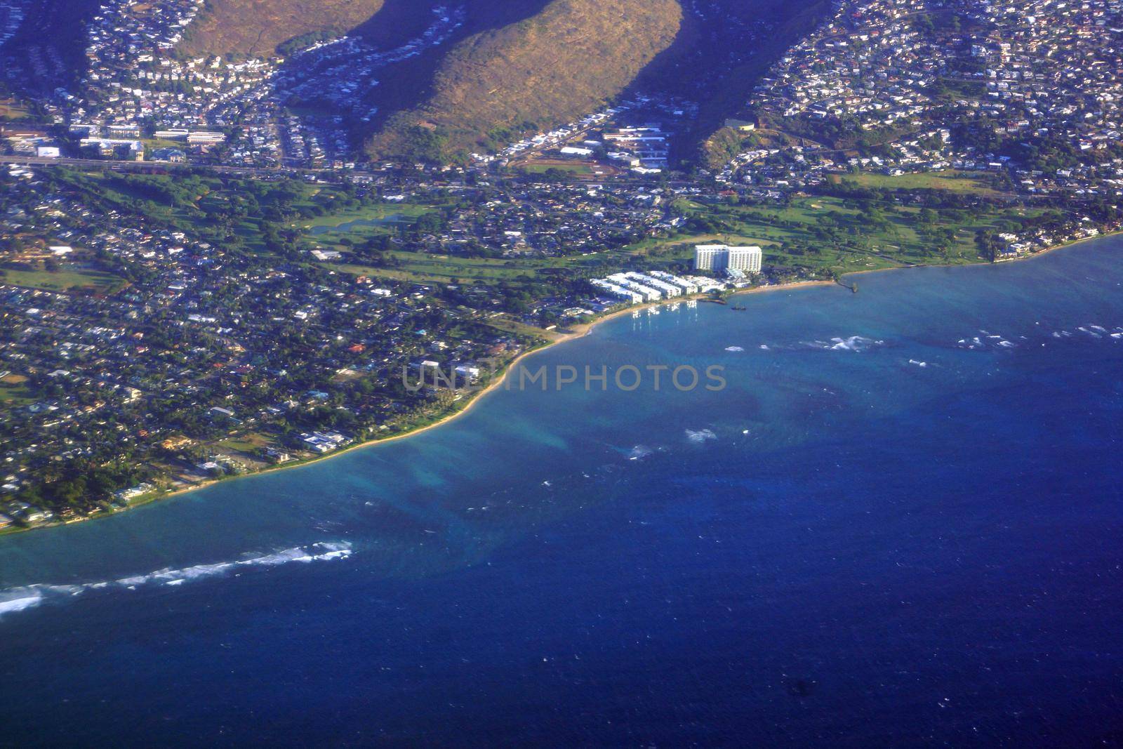 Aerial view of Kahala, and H-1 Highway, Hotel, Pacific ocean, clouds, and Golf Course on Oahu, Hawaii.