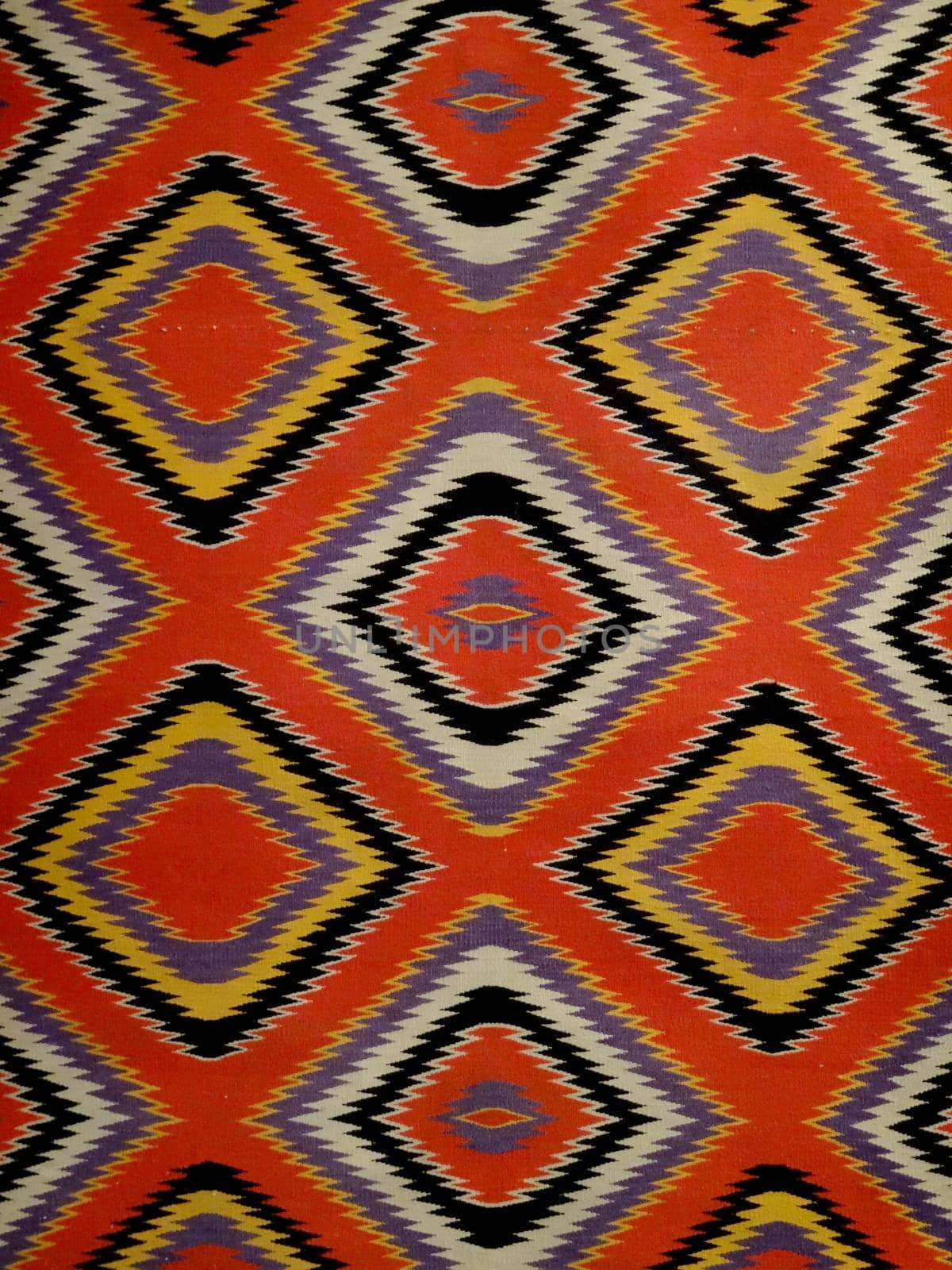 Pattern Red, Orange, White, purple, Black, and yellow Diamond Blanket/ Rug - Navajo Artist, made about 1885 of cotton and wool.                              