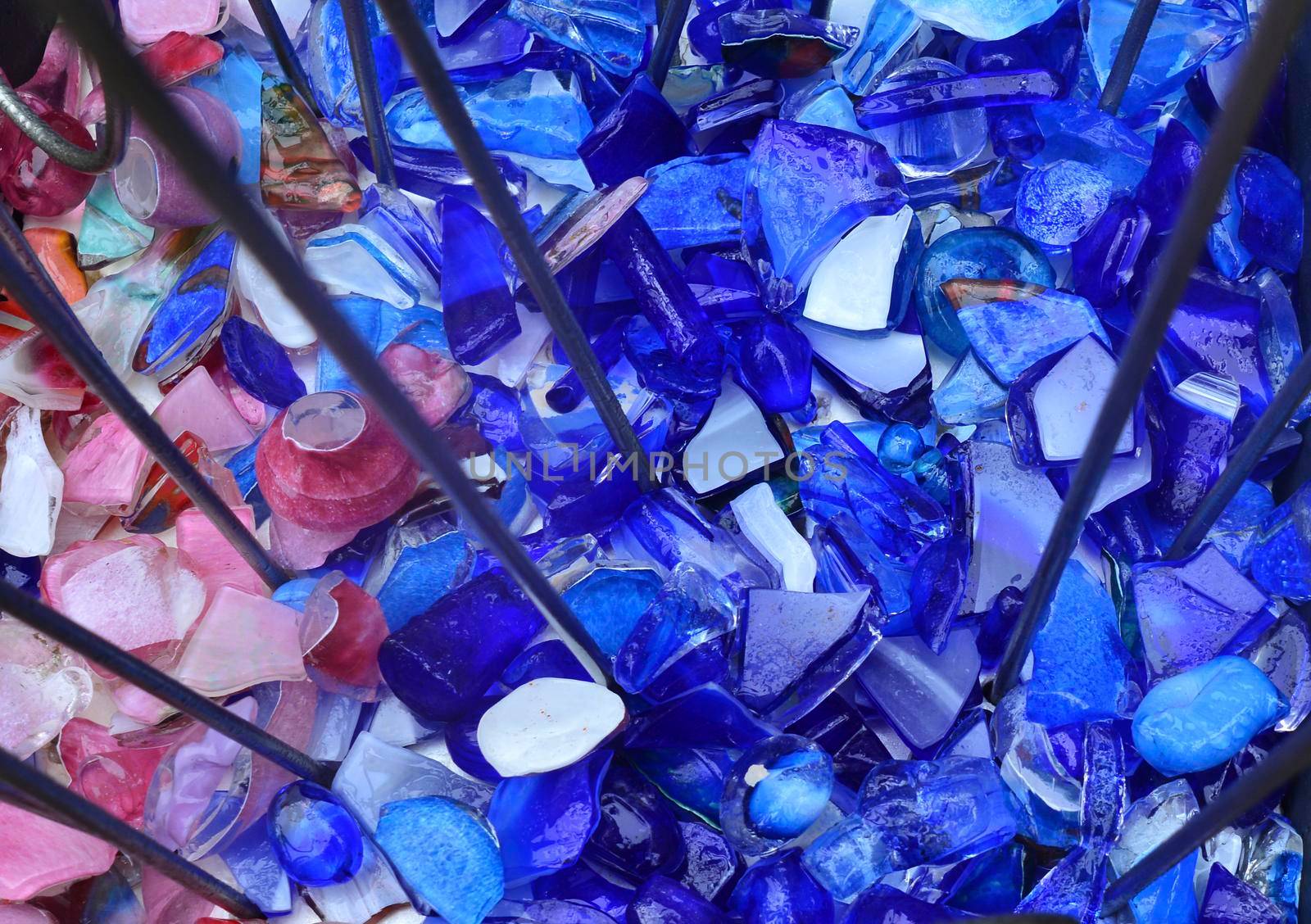 Broken violet and pink glass Background or texture