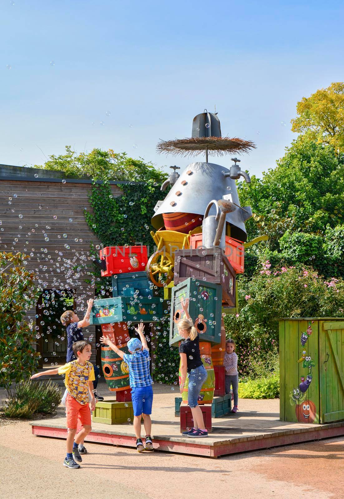 TERRA BOTANICA, ANGERS, FRANCE - SEPTEMBER 24, 2017: Colored construction of wooden boxes with soap bubbles for children