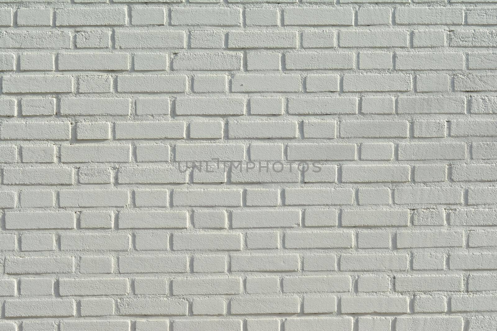 White brick wall background and texture Sun day