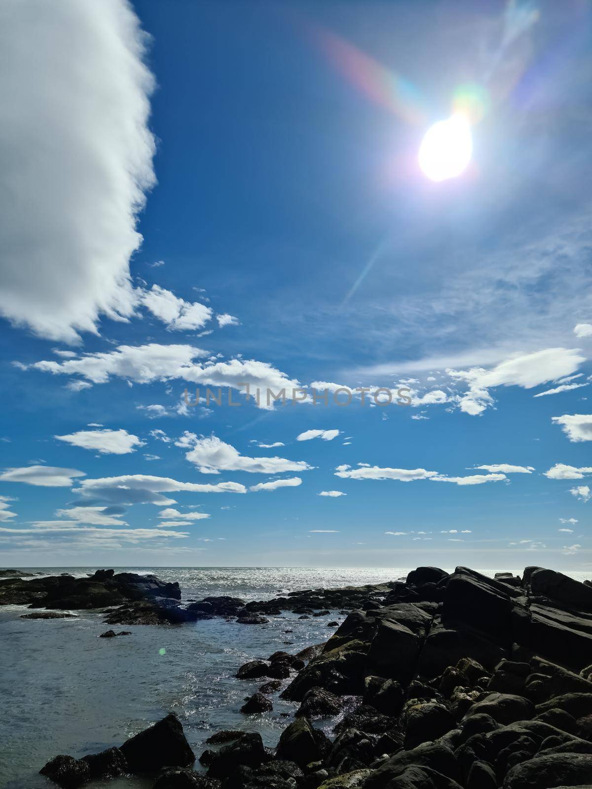 A surf on a rocky beach with black sand in Iceland