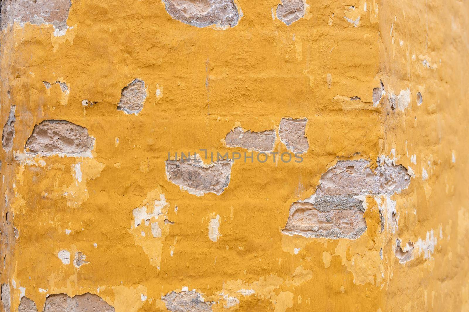 Yellow shabby wall background texture