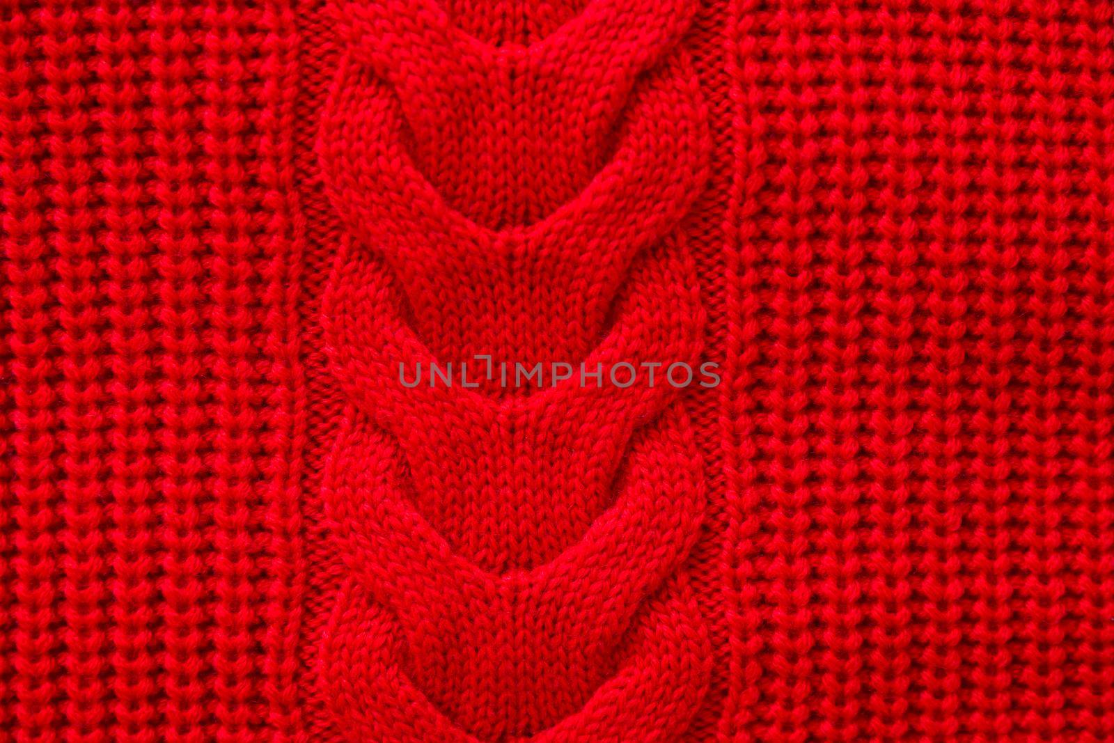 Red knitted winter sweater Background texture
