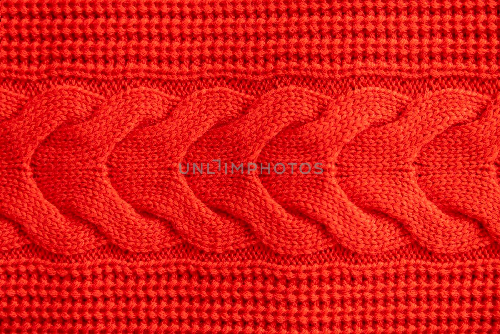 Red knitted winter sweater Background texture