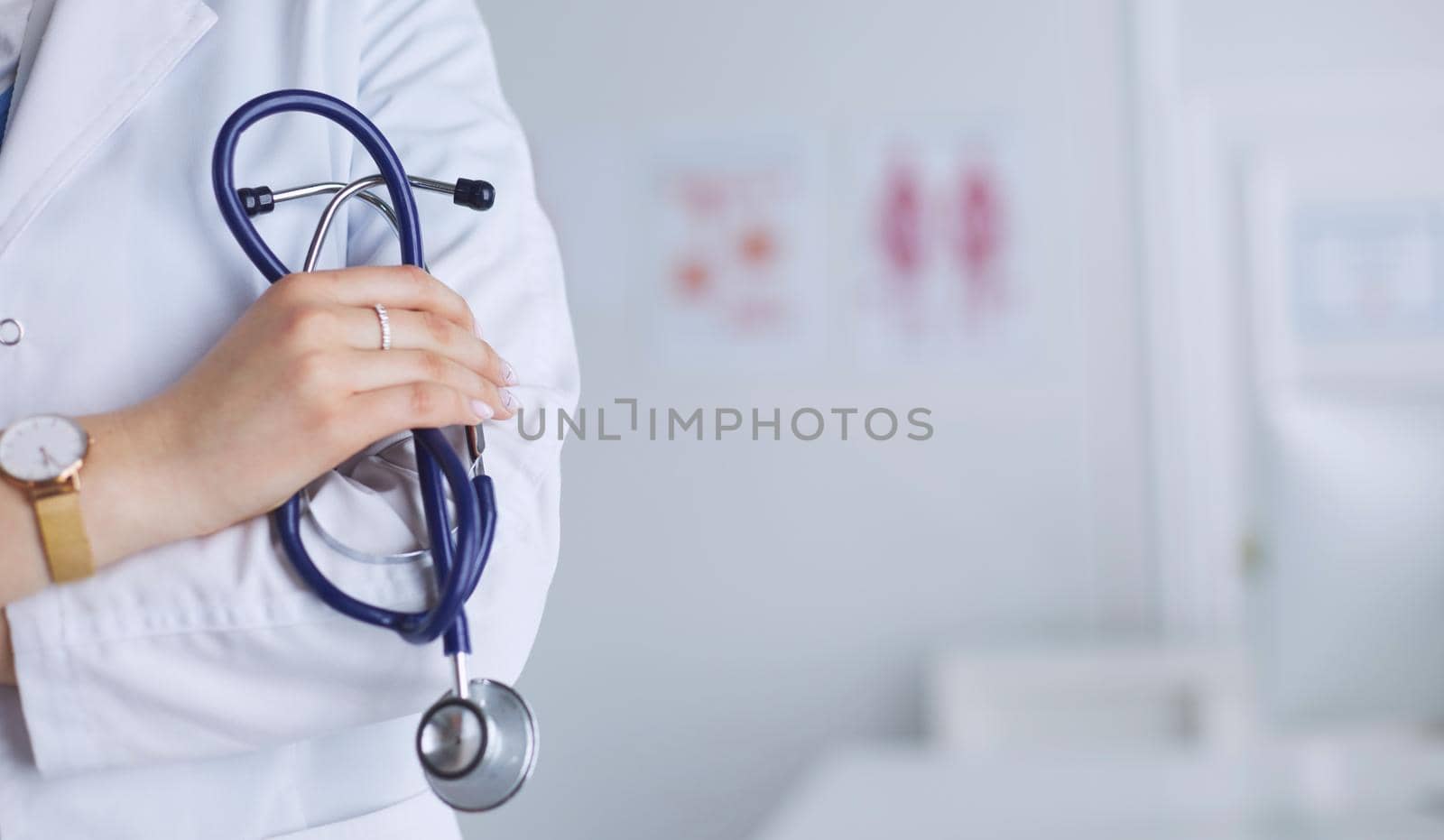 Smiling medical doctor woman with stethoscope in hospital.