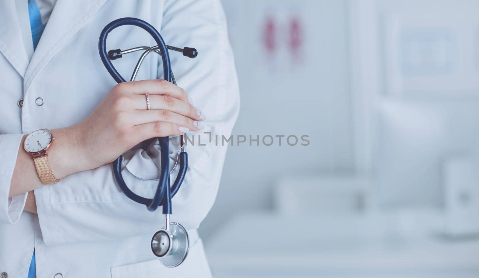 Smiling medical doctor woman with stethoscope in hospital.