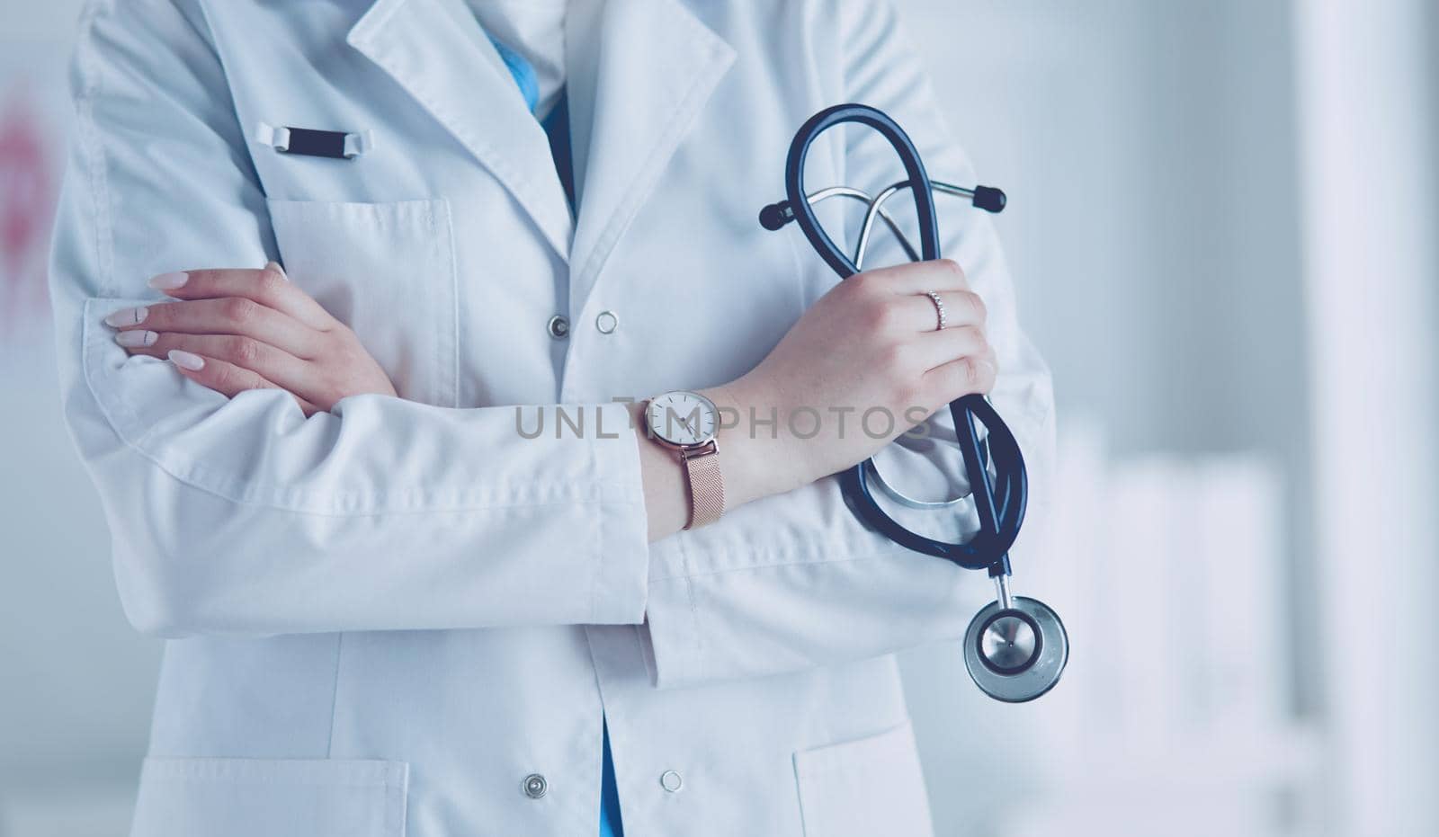 Smiling medical doctor woman with stethoscope in hospital.