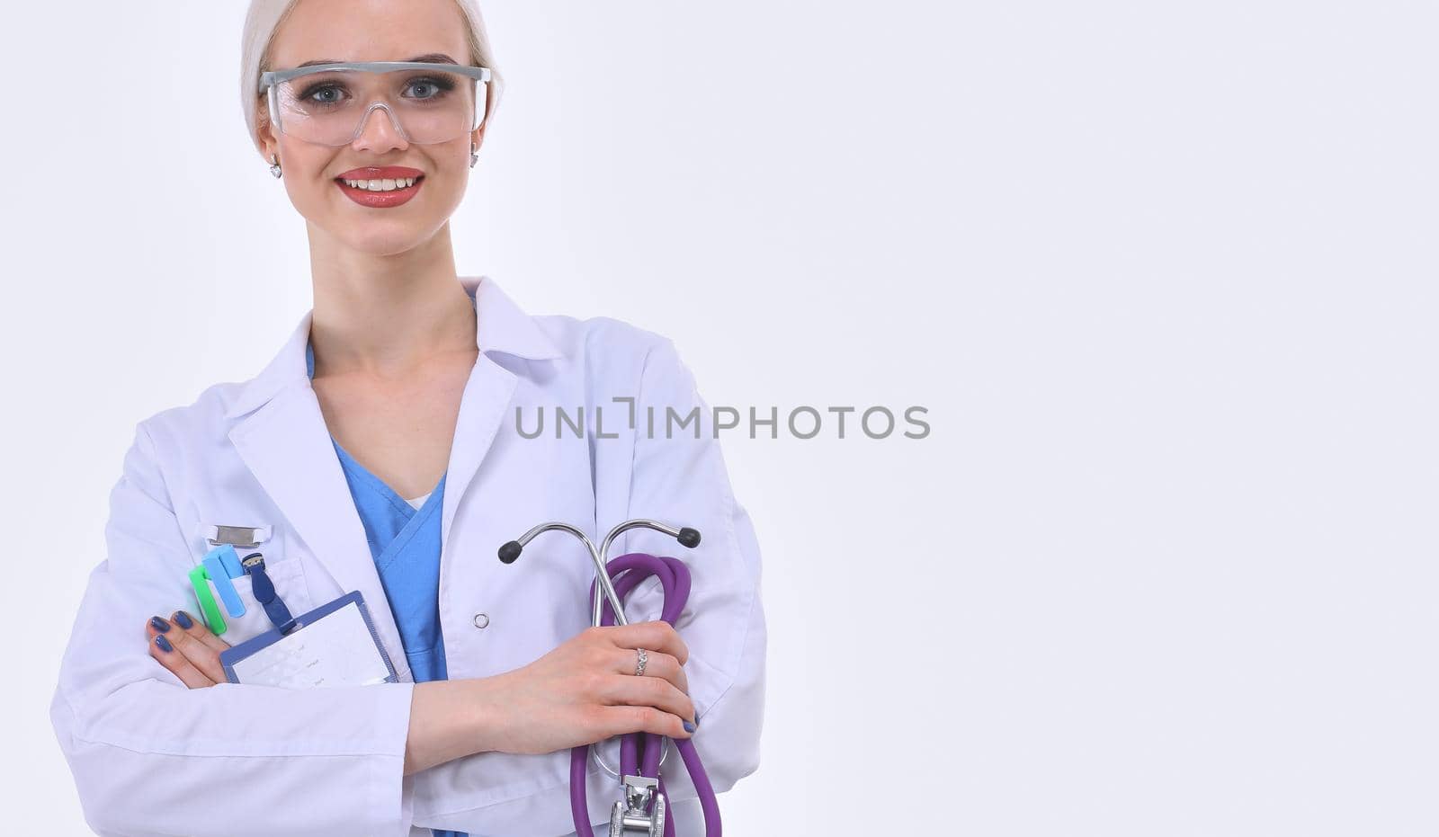 Portrait of female doctor standing against isolated on white background. Woman doctor