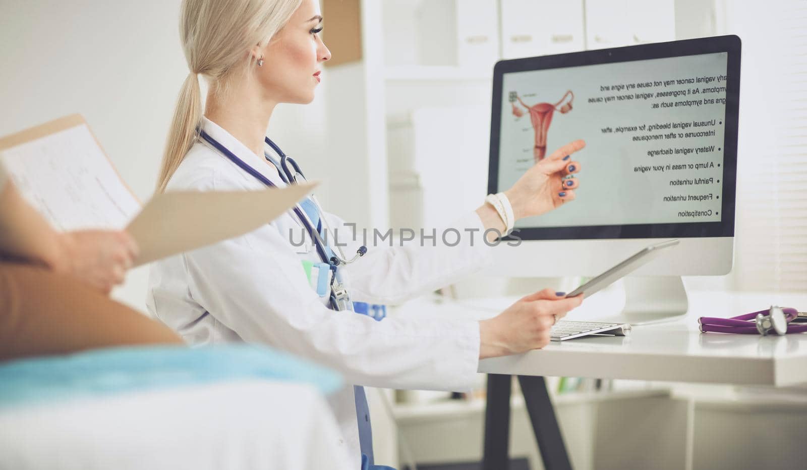 Doctor and patient discussing something while sitting at the table . Medicine and health care concept. Doctor and patient.