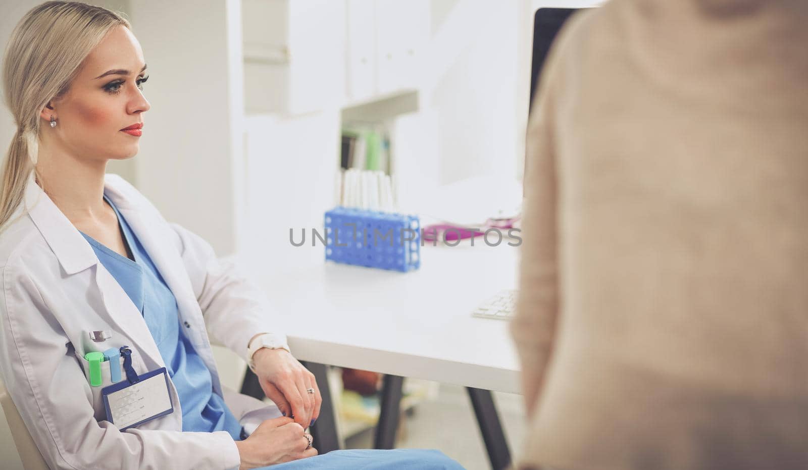 Doctor and patient discussing something while sitting at the table . Medicine and health care concept. Doctor and patient.