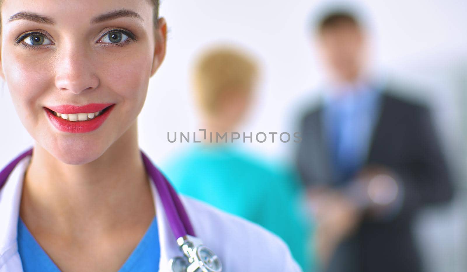 Woman doctor standing with stethoscope at hospital .