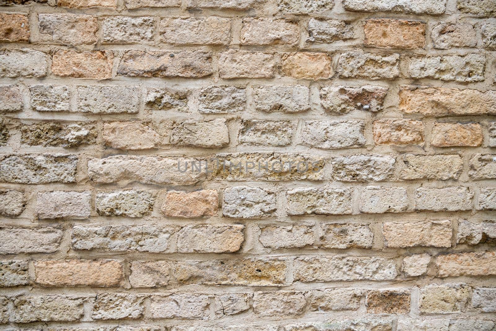 Beige brick wall background grunge texture