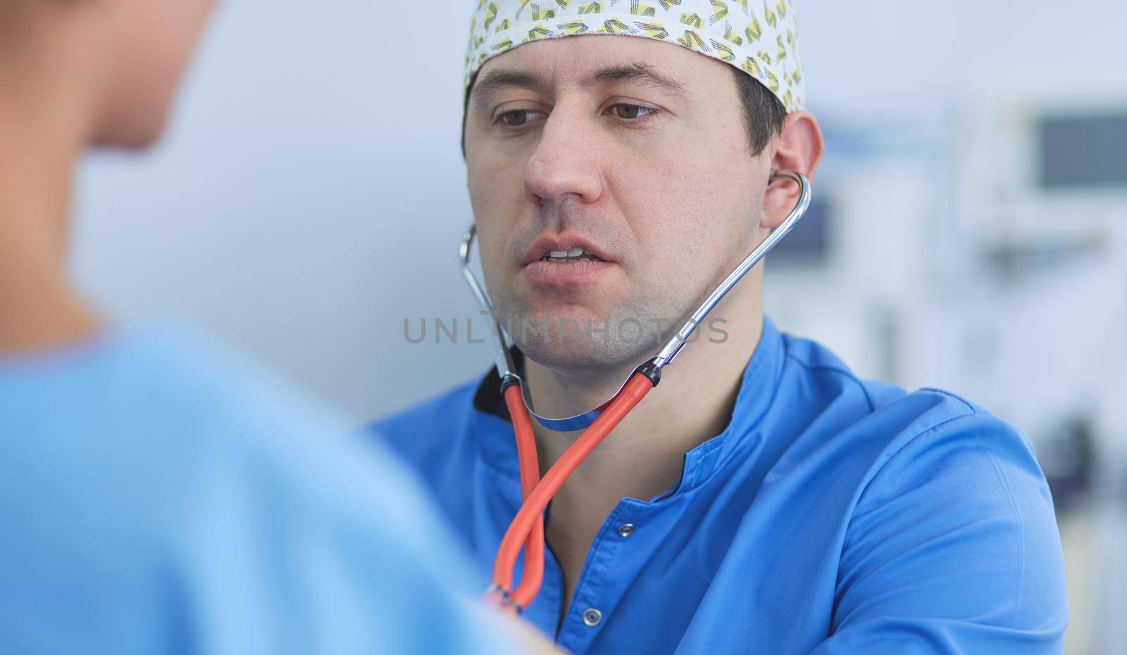 Man surgeon at work in operating room.