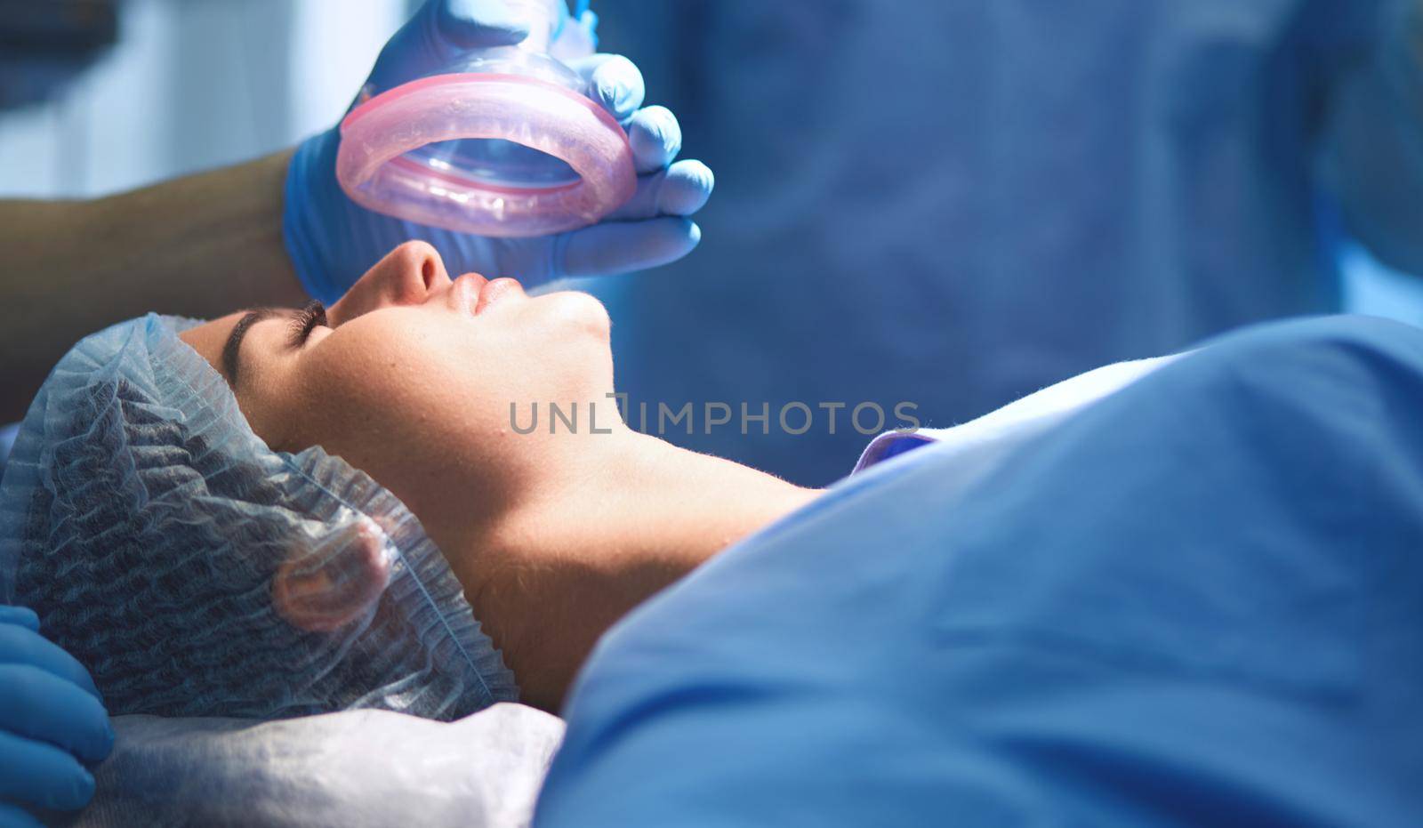 Team surgeon at work in operating room.
