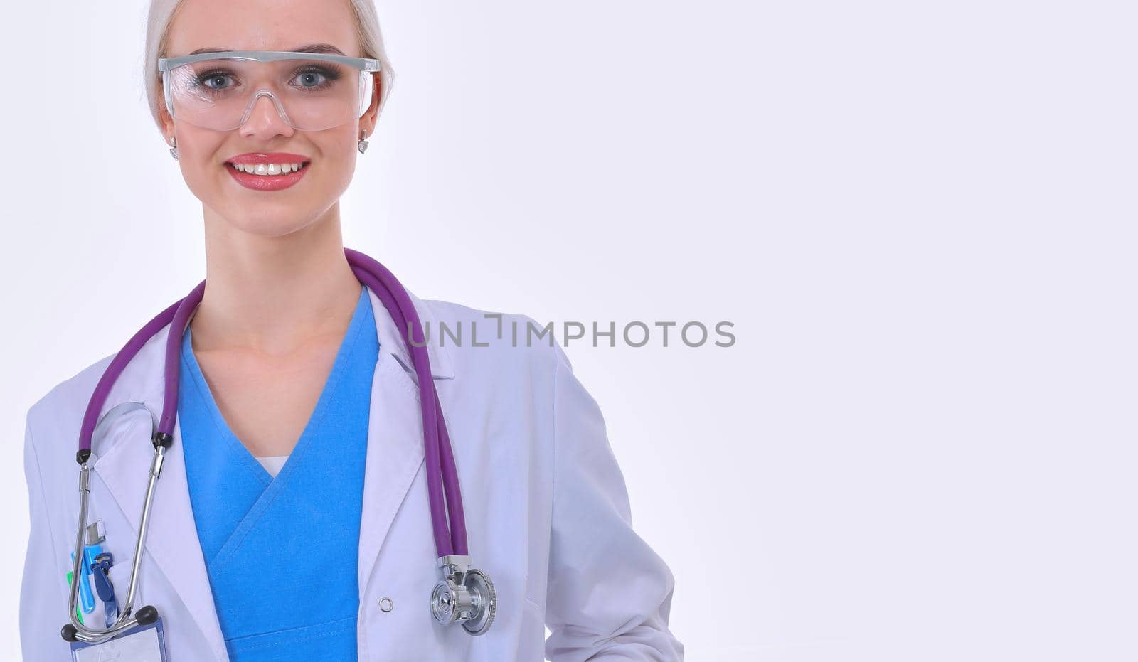 Portrait of female doctor standing against isolated on white background. Woman doctor