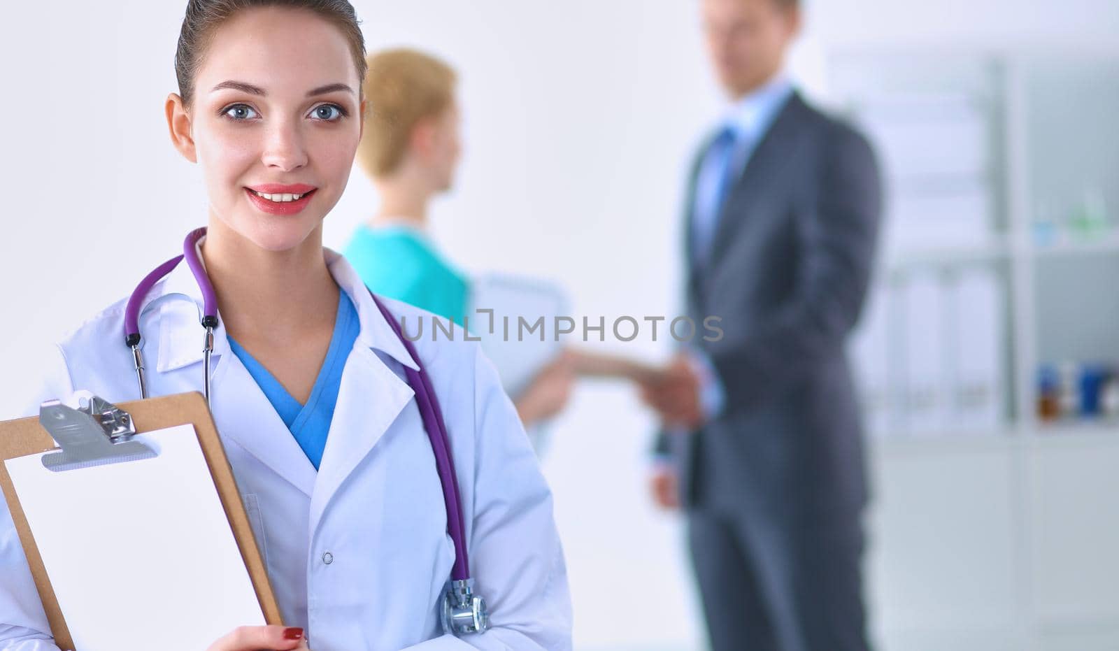Woman doctor standing at hospital .