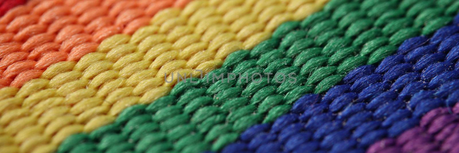 Close-up of rainbow lgbt carpet or flag symbol of bisexual homosexual gay lesbian transgender idea. Textile material, support lgbt. Gay movement concept