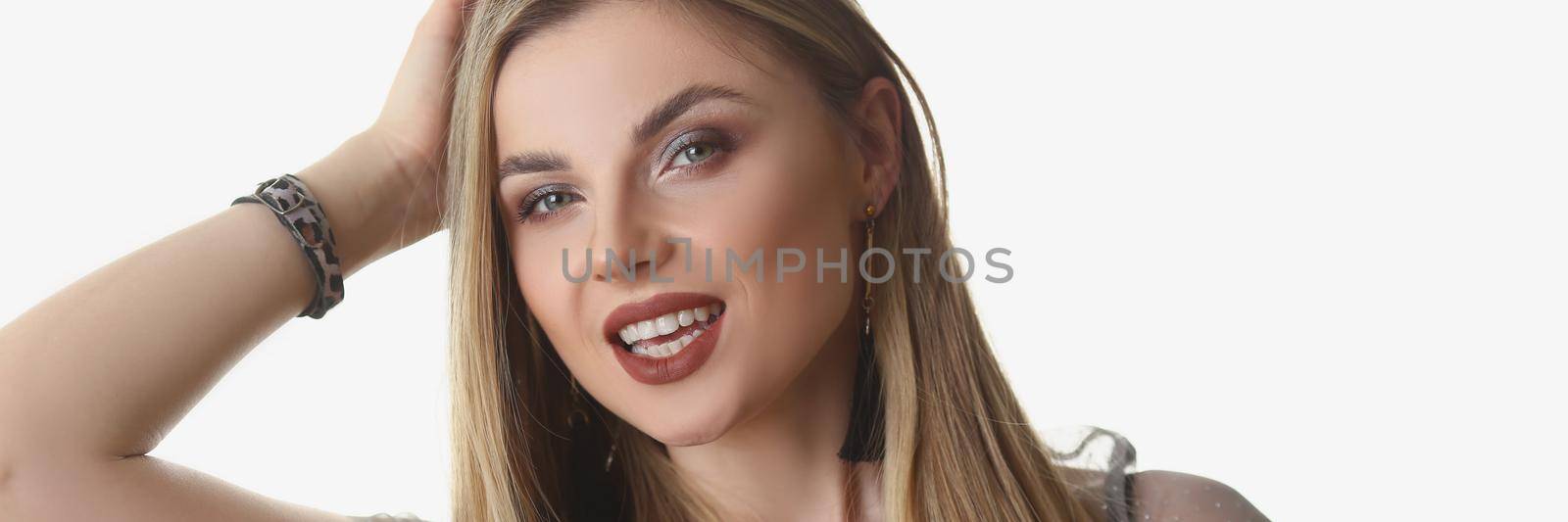 Portrait of beautiful stylish young blonde woman posing on white background in studio. Professional model work for model agency. Modeling, beauty concept