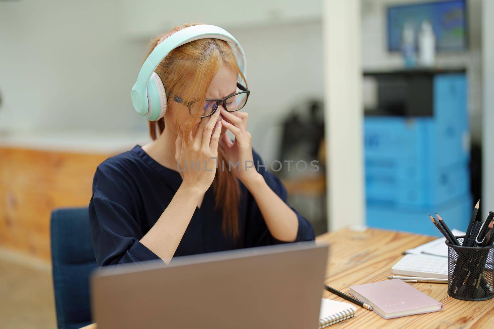 Portrait of an Asian teenage girl looking tired and frustrated, depressed from not achieving her goals by Manastrong