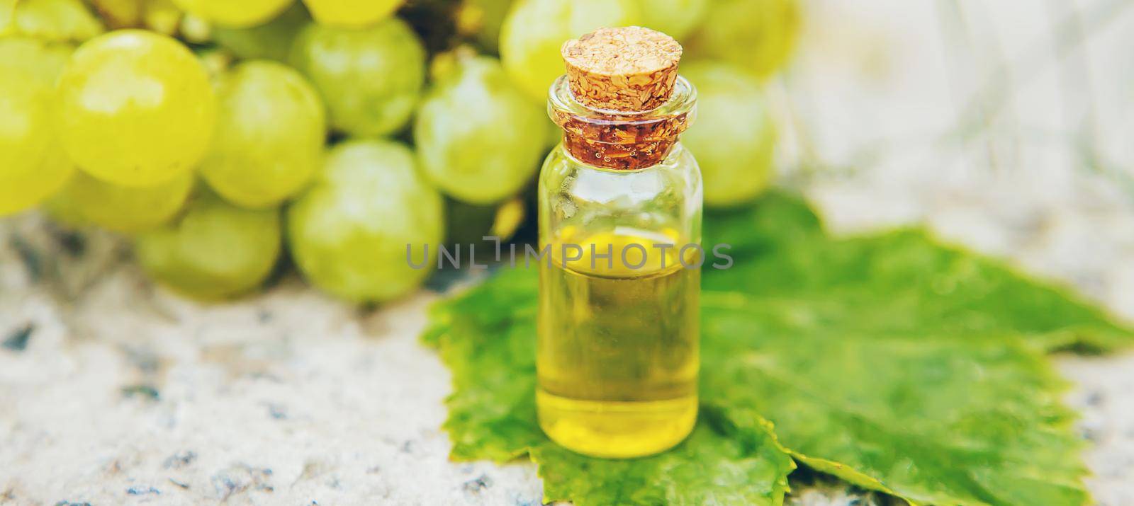 grape seed oil in a small jar. Selective focus.nature