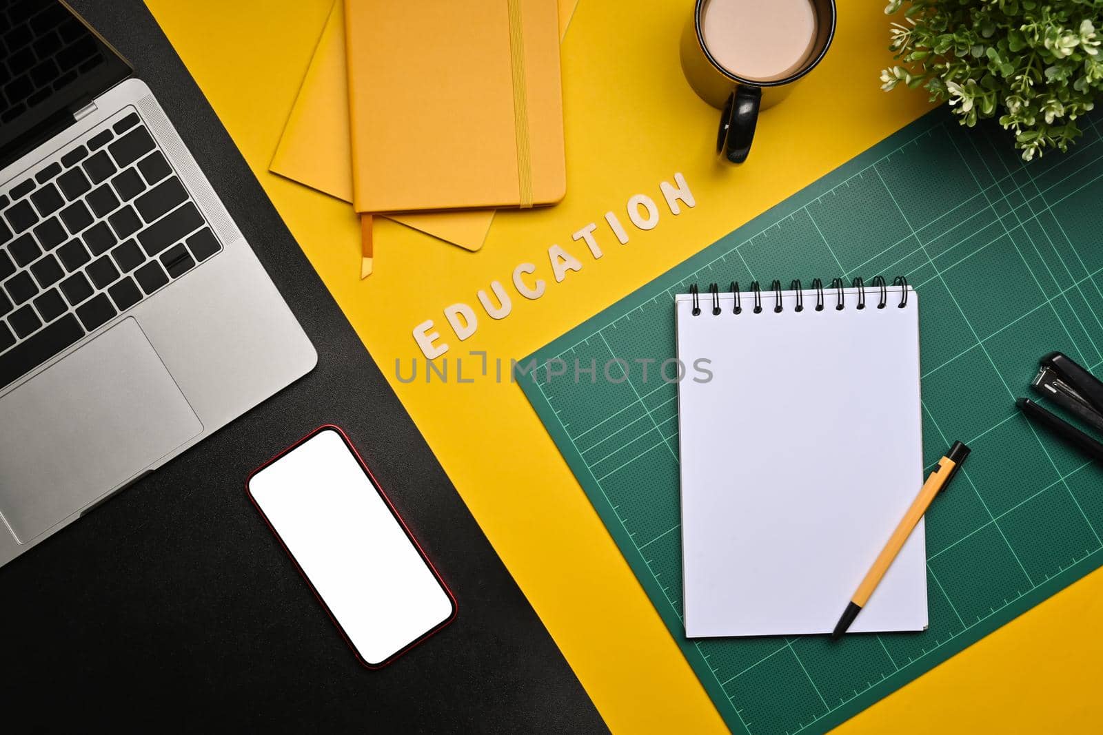 Mock up smart phone, laptop computer, coffee cup and stationery on yellow background.