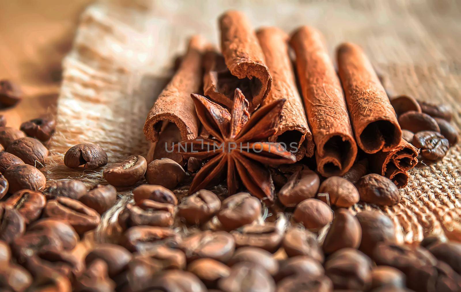 Anise stars and cinnamon on roasted coffee beans.selectiv focus .food