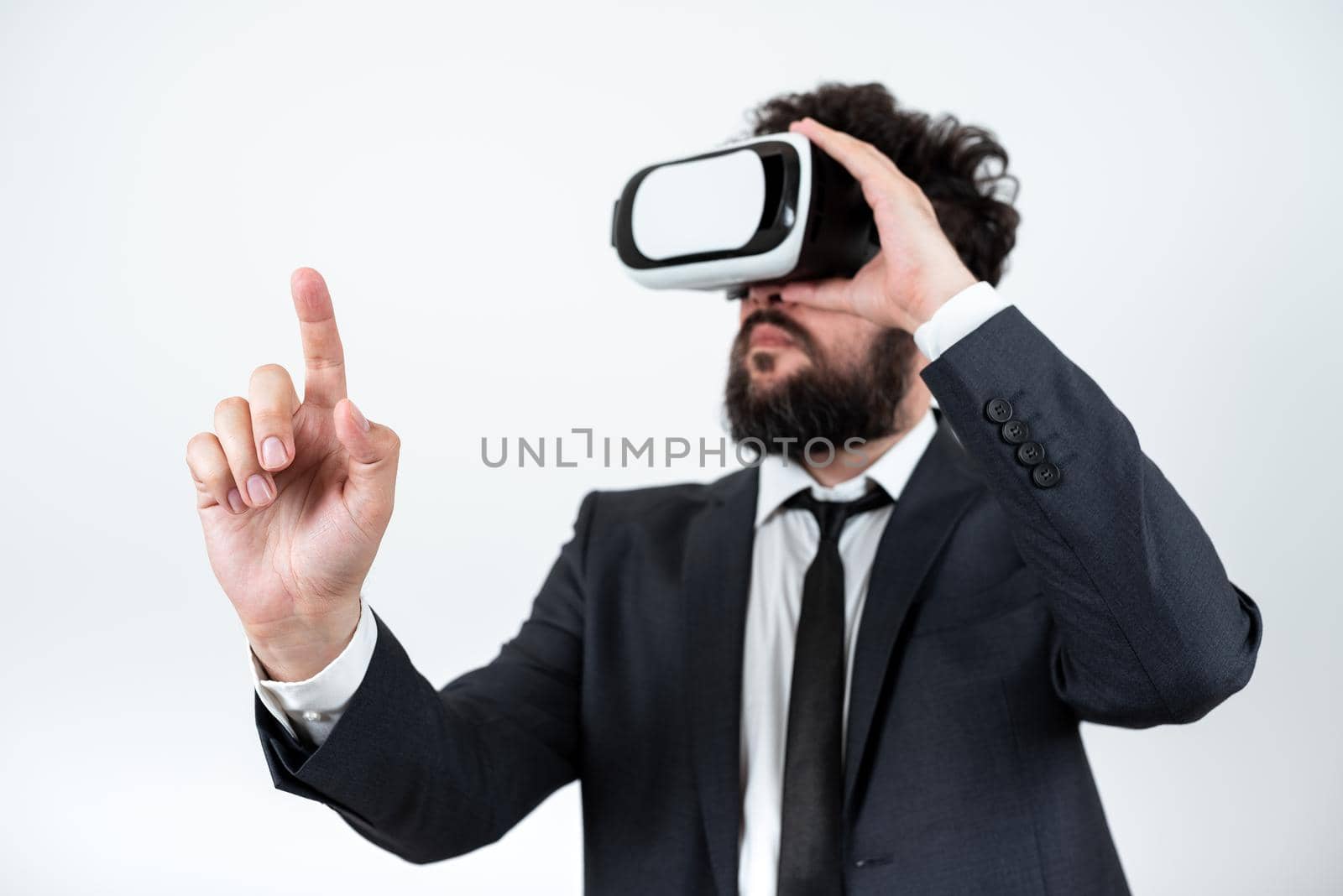 Man Wearing Vr Glasses And Pointing On Important Messages With One Finger.