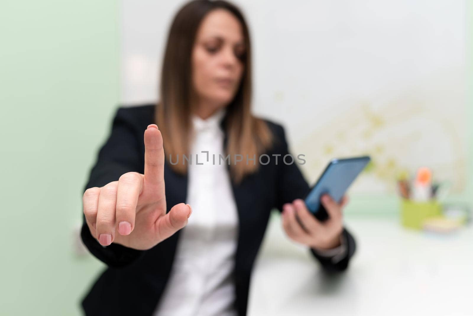 Woman Holding Tablet With One Hand And Pointing New Ideas With One Finger.