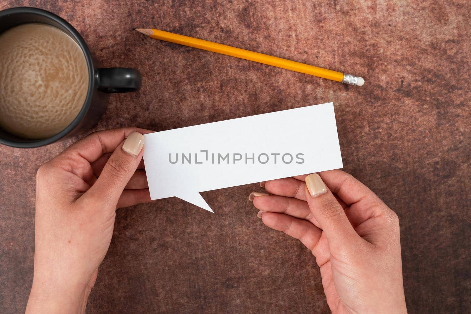 Hands Of Woman Holding Speech Bubble And Representing Thoughts.